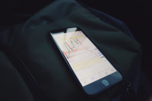 iPhone with stock chart displayed