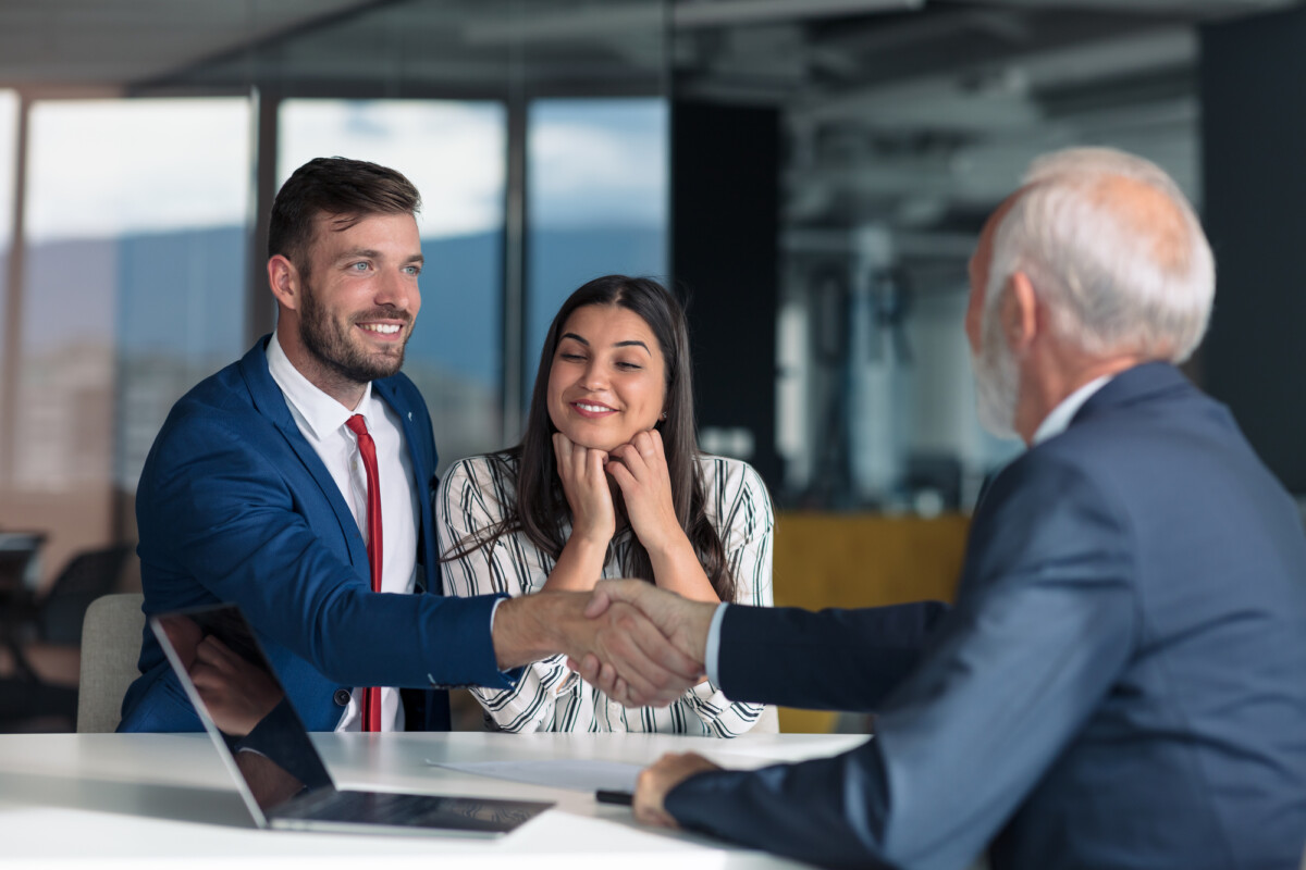 A professional meeting with a handshake, representing a successful agreement or partnership.
