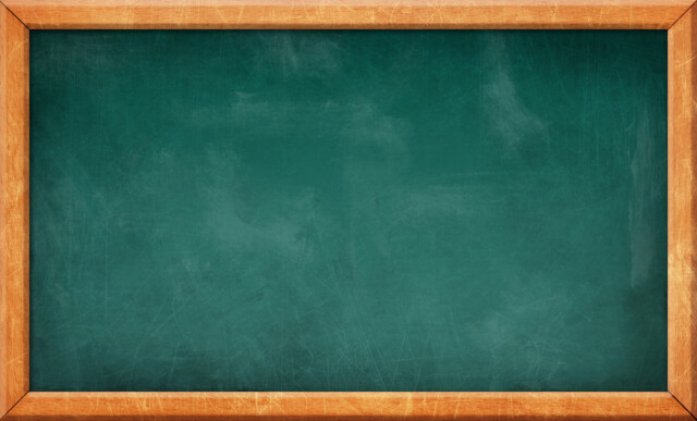 A blank green chalkboard with a wooden frame, showing some smudges and scratches but no writing or drawings.