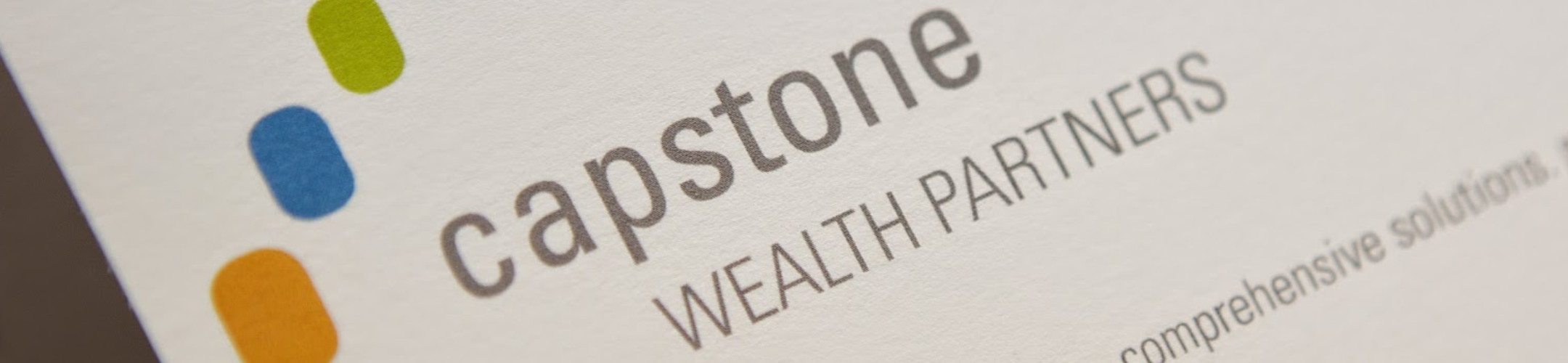 A close-up of a business card displaying the logo and name 